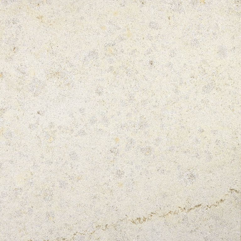 Swatch image for Bavarian Limestone - Beige - Pavers. The surface finish shown is sand blasted. Dominant colors shown are beige and cream; with a pink secondary. The color mix creates a warm feeling. Solid and cloudy color patterns. Contains mineral inclusions.