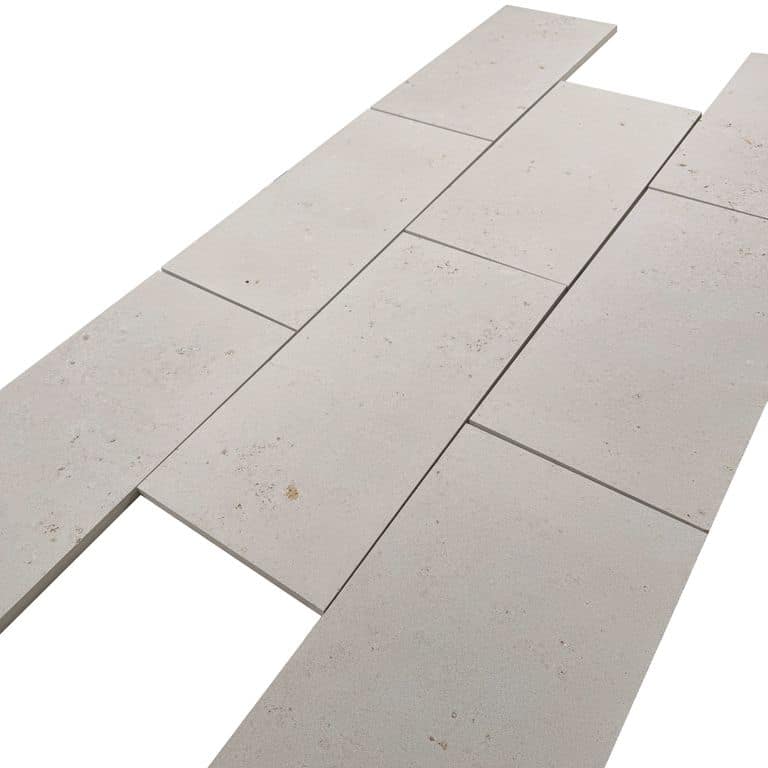 Color/Finish variation image for Bavarian Beige Limestone - Pavers. The surface finish shown is sand blasted. Dominant colors shown are beige, gray and cream. The color mix creates a warm feeling.