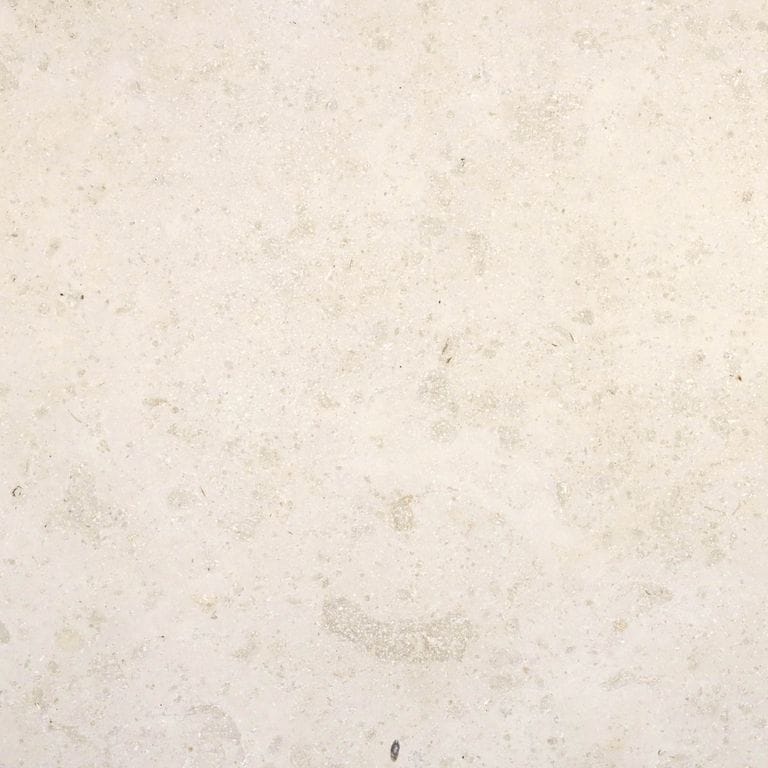 Swatch image cropped for Bavarian Limestone Gala - Beige - Pool Coping. The surface finishes shown are brushed and sand blasted. Dominant colors shown are beige and cream; with white and tan secondaries. Exhibits "movement" and the color mix creates a warm feeling. Regular color pattern. Contains mineral inclusions.