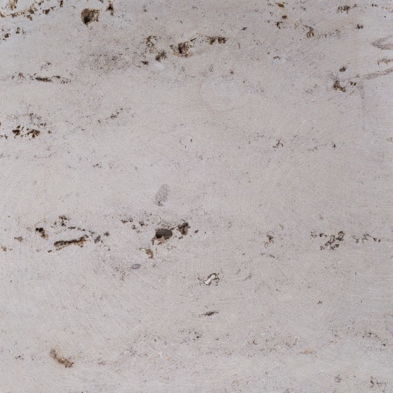 Color/Finish variation image for Bavarian Travertine - Beige - Wall Veneer. The surface finish shown is honed. The dominant color shown is gray; with beige, blue, brown, pink, purple and white secondaries. Exhibits "movement" and the color mix creates a warm feeling. Random and cloudy color patterns.