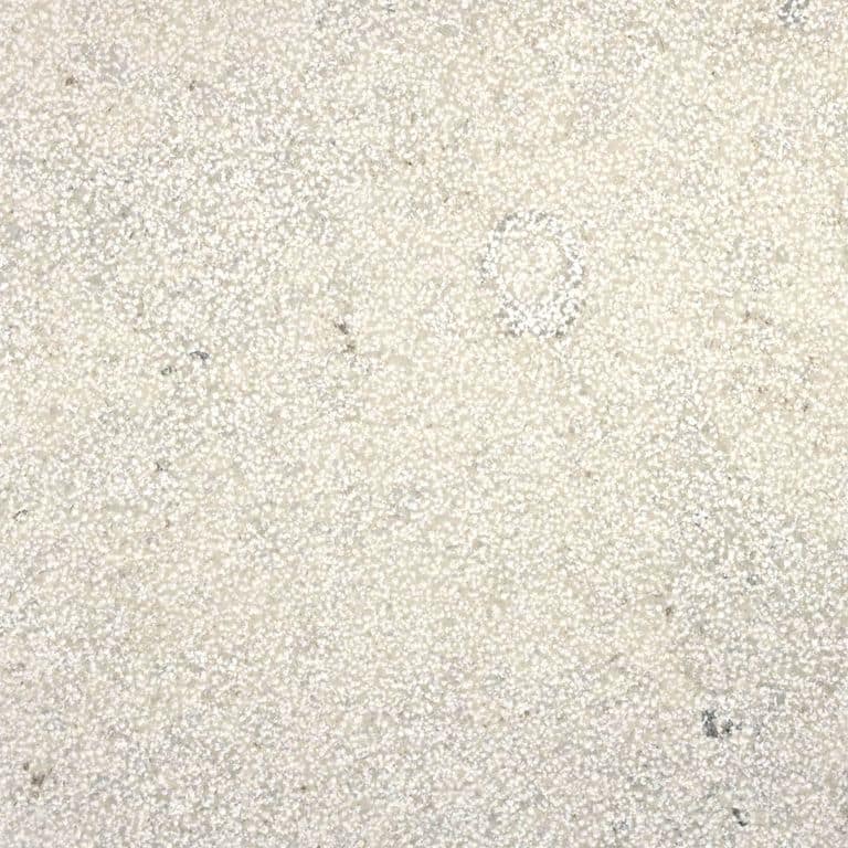 Color/Finish variation image for Bavarian Gray Limestone - Pool Coping. The surface finish shown is bush hammered. Dominant colors shown are beige and cream. The color mix creates a warm feeling. Speckled color pattern.