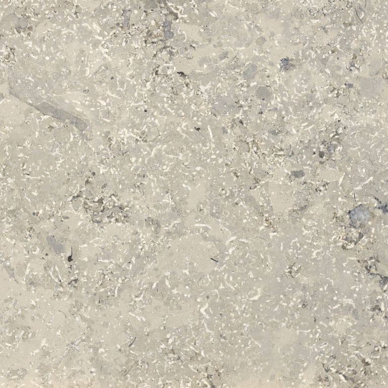 Swatch image for Bavarian Limestone - Gray - Interior Floor. The surface finish shown is honed. Dominant colors shown are beige and gray; with purple, white, tan and cream secondaries. The color mix creates a warm feeling. Blotched, random and cloudy color patterns. Contains mineral inclusions.