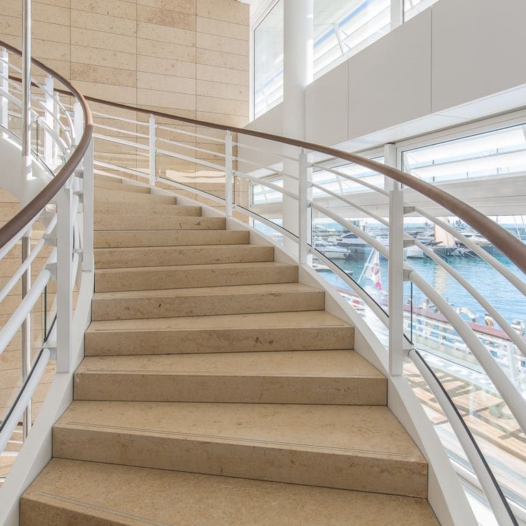 Application image for Bavarian Beige Limestone - Steps &amp; Treads. The image shows this product being used in a treads application. This is a building and landscape stone for indoor and outdoor commercial and residential applications. Suitable for general use, high traffic areas, low slipperiness surfaces and high heel compatibilty situations. Moderate to higher on the price spectrum.