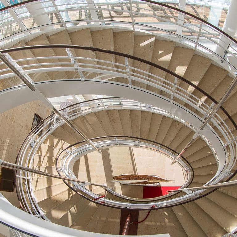 Application image for Bavarian Beige Limestone - Steps &amp; Treads. The image shows this product being used in a treads application. This is a building and landscape stone for indoor and outdoor commercial and residential applications. Suitable for general use, high traffic areas, low slipperiness surfaces and high heel compatibilty situations. Moderate to higher on the price spectrum.