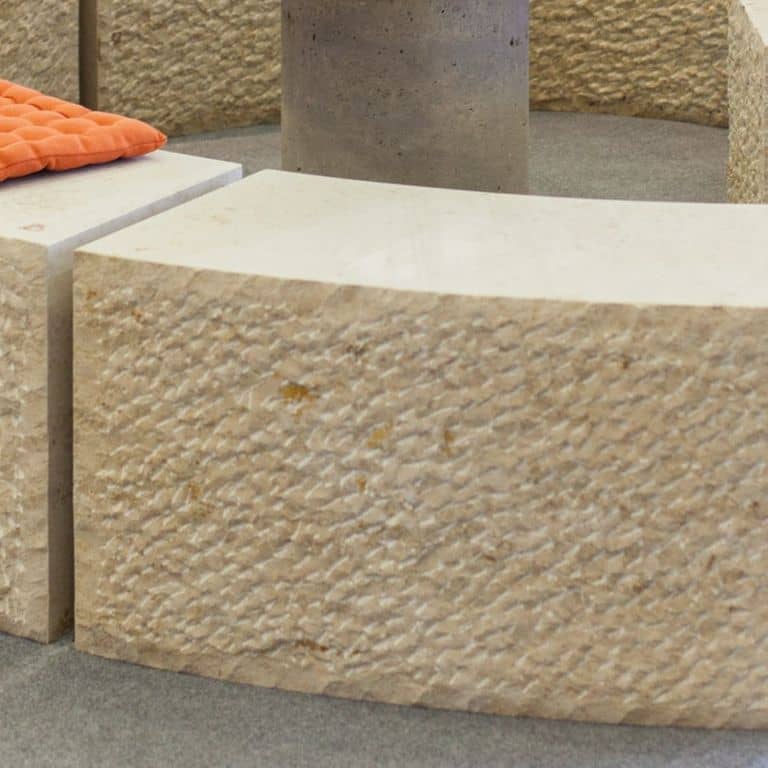 Close-up image for Bavarian Limestone Gala - Beige - Benches &amp; Seating. The surface finish shown is chiseled. Dominant colors shown are beige, brown and tan; with a cream secondary. The color mix creates a warm feeling. Regular and speckled color patterns. Contains mineral inclusions.