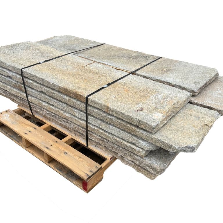 Oblique image for Reclaimed Footworn Granite - Pool Deck. The surface finish shown is . Dominant colors shown are beige, gray and tan. The color mix creates a warm feeling.