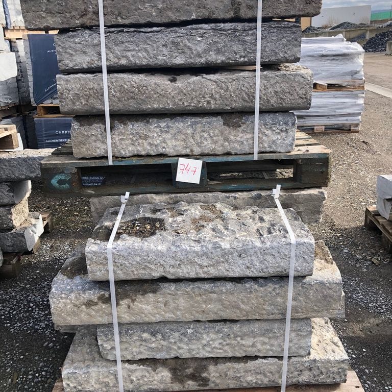 Feature image for Limestone - Reclaimed Belgian Bluestone Curbstone. The surface finish shown is . The dominant color shown is gray; with beige, white and tan secondaries. Exhibits "movement". Speckled, blotched and cloudy color patterns.