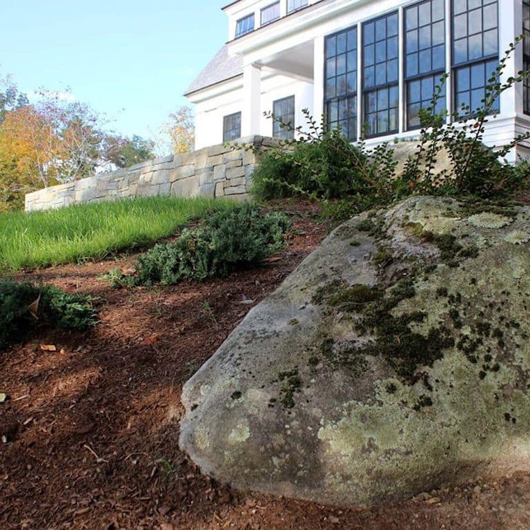 Application image for New England Fieldstone Boulders &amp; Ledgestone - Jumbo Boulders. The surface finish shown is weathered. The dominant color shown is gray. The color mix creates a warm feeling.