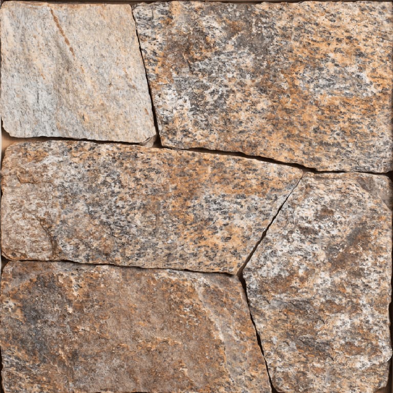 Close-up image for Oak Ridge Granite - Veneer. The surface finish shown is split-face with flat plane. Dominant colors shown are brown, orange/rust and tan; with beige and gray secondaries. Exhibits "movement" and the color mix creates a warm feeling. Random, coarse speckled and blotched color patterns.