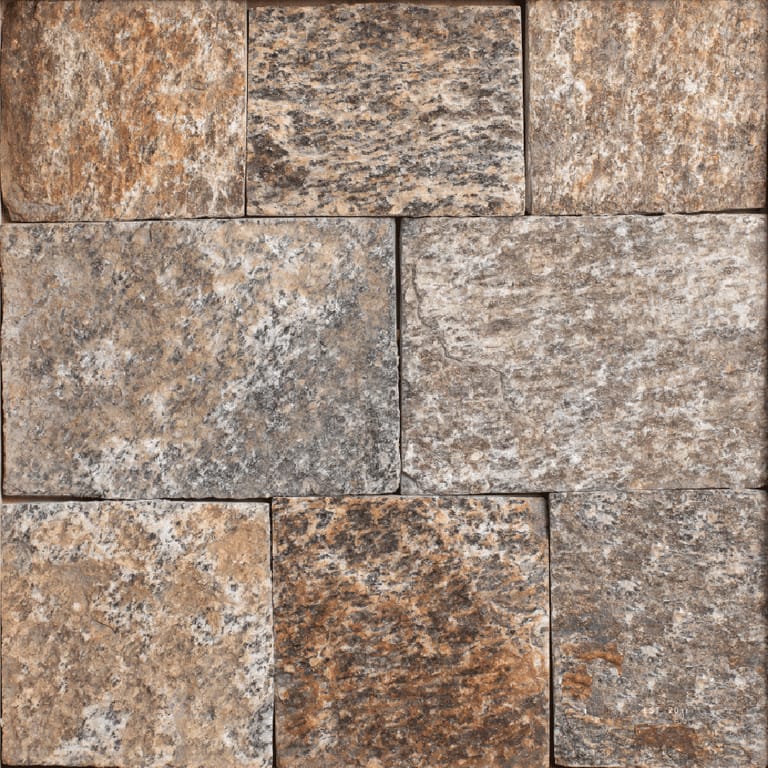 Feature image for Oak Ridge Granite - Veneer. The image shows this product being used for full bed veneer and thin veneer. Dominant colors shown are brown, gray and tan; with beige, orange/rust and purple secondaries. Exhibits "movement" and the color mix creates a warm feeling. Regular, speckled, blotched and streaked color patterns.