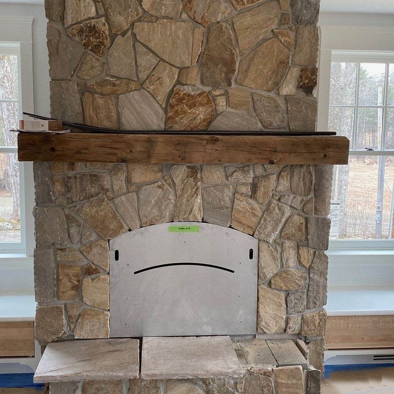 Feature image for Quartzite - Sterling Tan - Veneer. The image shows this product being used for fireplace surround, full bed veneer, thin veneer and interior cladding. The surface finish shown is split-face. Dominant colors shown are beige, brown, gray and tan. Exhibits "movement" and the color mix creates a warm feeling. Regular and random color patterns.