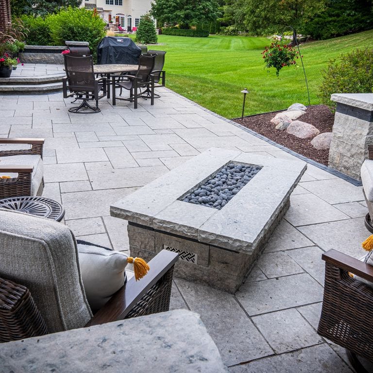 Application image for Madison Limestone - Pavers. The image shows this product being used in a patio pavers application. The surface finish shown is flamed. The dominant color shown is gray. The color mix creates a cool feeling.