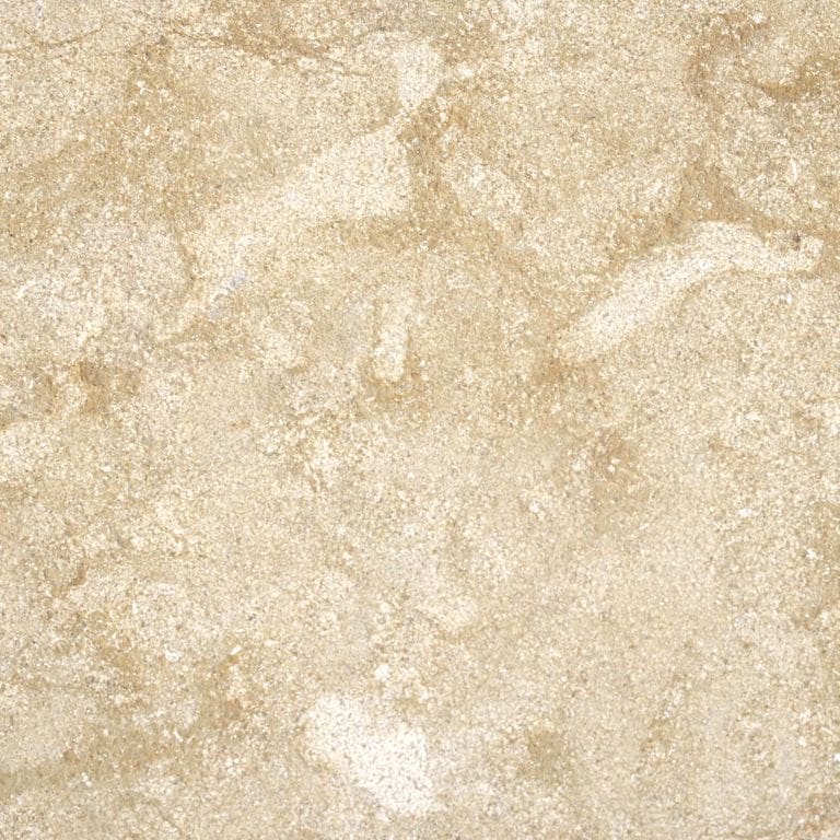 Swatch image for Cenia Beige Limestone Pool Deck Pavers. The surface finish shown is a combination of brushed and fine bush hammered. Dominant colors shown are beige and tan; with orange/rust, pink and cream secondaries. The color mix creates a warm feeling. Blotched and random color patterns.