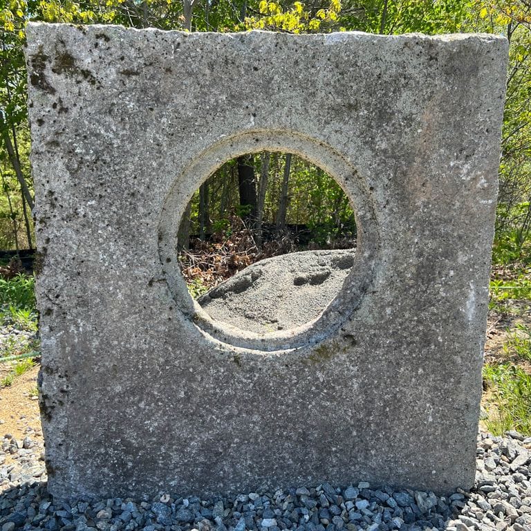 Application image for Granite - Reclaimed - Manhole Stones. The surface finish shown is . The dominant color shown is gray; with brown, purple and white secondaries. Fine speckled color pattern.
