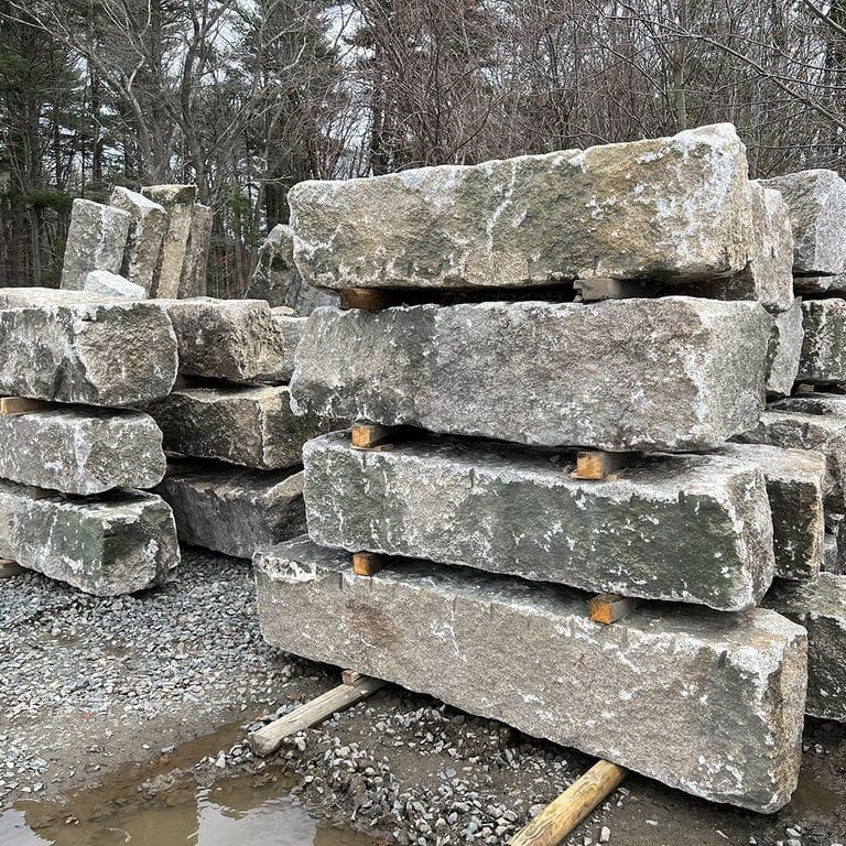 Feature image for Granite - Reclaimed - Jetty Stones. The surface finish shown is . The dominant color shown is gray; with beige, brown, green, purple, white and cream secondaries. The color mix creates a warm feeling. Speckled color pattern.