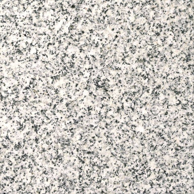 Swatch image cropped for Dodlin Hill Granite - Live Edge Steps. The surface finish shown is flamed. Dominant colors shown are gray, white and cream; with beige and pink secondaries. Speckled color pattern.