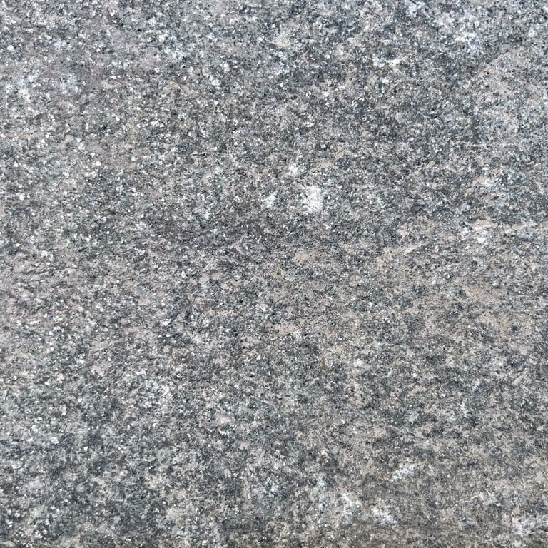 Swatch image for Reclaimed Quartzite Plank Pavers - Blue/Gray - Gauged. The surface finish shown is a combination of split-face with flat plane, weathered and worn. The dominant color shown is gray; with beige, blue, brown, purple and white secondaries. The color mix creates a cool feeling. Regular, fine speckled and random color patterns. Contains some mica.