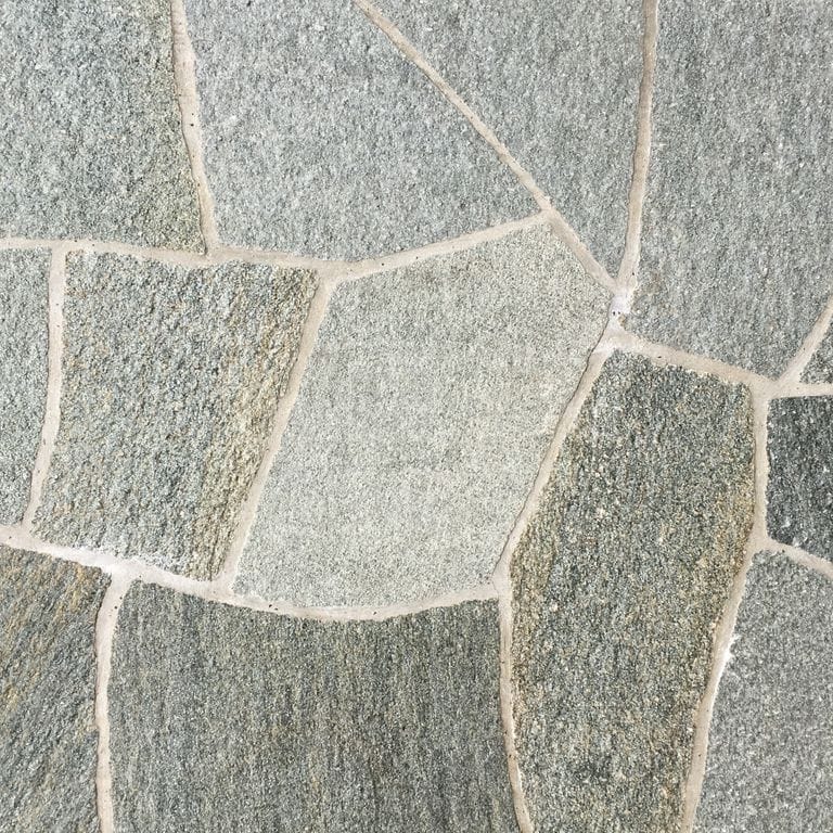 Application image for Pietra Italia Gneiss - Natural Surface Irregular Pavers. The surface finish shown is natural cleft. Dominant colors shown are gray and tan. The color mix creates a warm feeling.