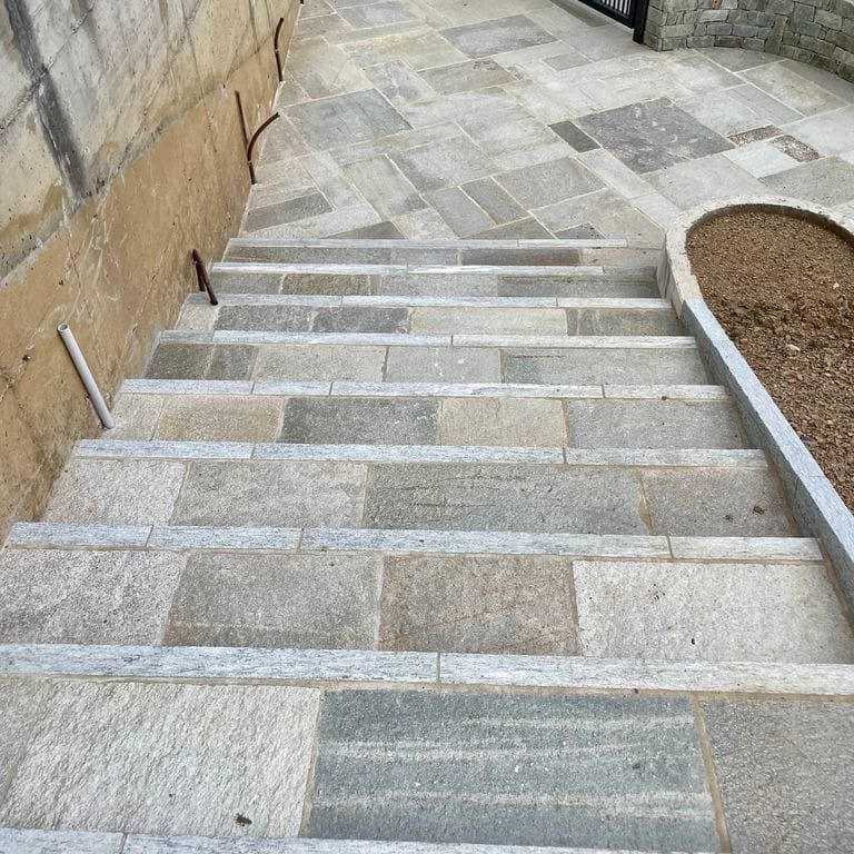 Application image for Pietra Italia Gneiss - Treads. The image shows this product being used in a treads application. The surface finish shown is natural cleft. The dominant color shown is gray.