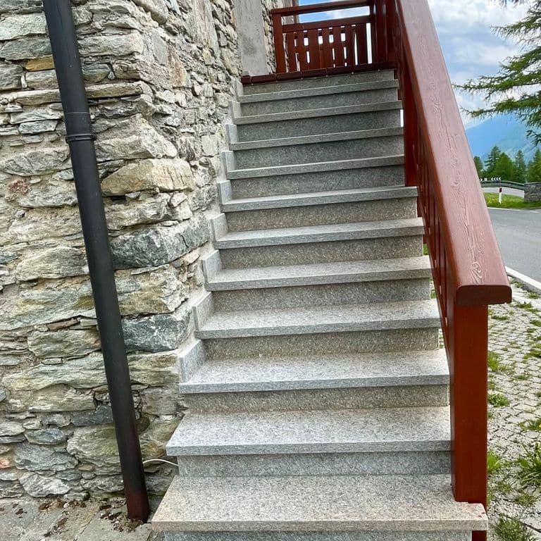 Application image for Pietra Italia Gneiss - Treads. The image shows this product being used in a treads application. The surface finish shown is natural cleft. Dominant colors shown are gray and tan. The color mix creates a warm feeling.