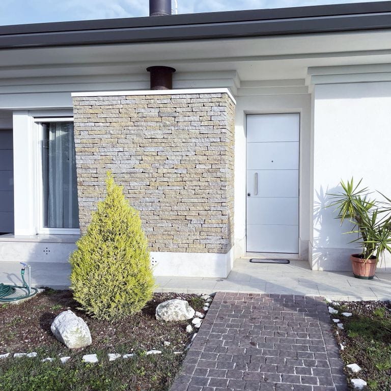 Application image for Pietra Italia Gneiss - Thin Veneer. The image shows this product being used in a thin veneer application. Dominant colors shown are gray and tan. The color mix creates a warm feeling.