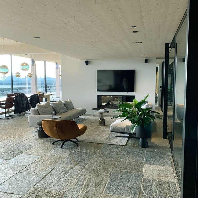 Application image for Pietra Italia Full Color Gneiss - Natural Cleft &amp; Brushed Interior Floor. The image shows this product being used in an interior floor application. Dominant colors shown are gray and tan. The color mix creates a warm feeling.