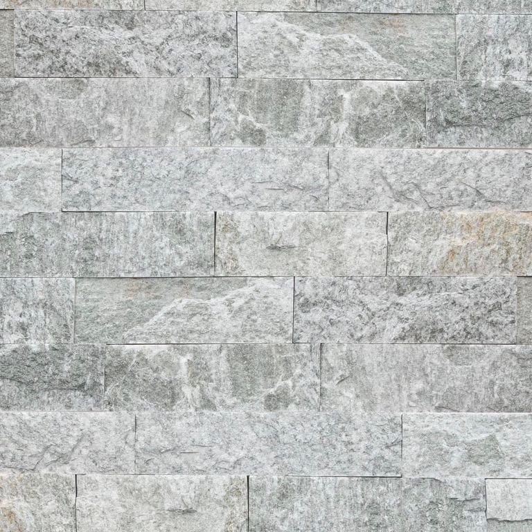 Best close-up image for Pietra Italia Gray Gneiss - Veneer. The image shows this product being used in a thin veneer application. The surface finish shown is natural cleft. The dominant color shown is gray. The color mix creates a cool feeling.