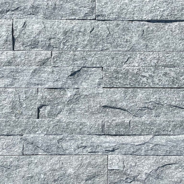 Application image for Pietra Italia Gray Gneiss - Veneer. The image shows this product being used in a thin veneer application. The surface finish shown is natural cleft. The dominant color shown is gray. The color mix creates a cool feeling.