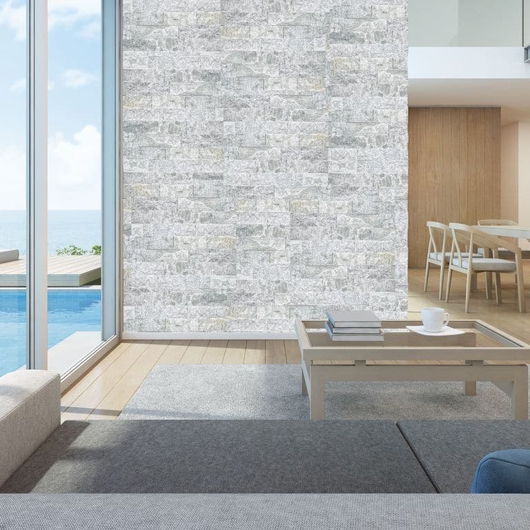 Application image for Pietra Italia Gray Gneiss - Veneer. The image shows this product being used in an interior cladding application. The dominant color shown is gray. The color mix creates a cool feeling.