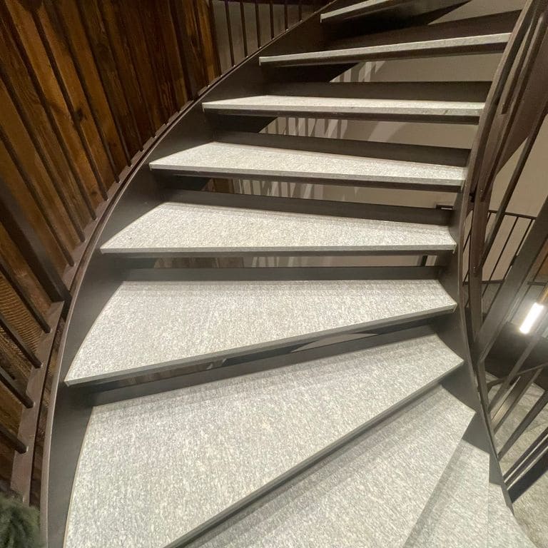 Application image for Pietra Italia Gray Gneiss - Treads. The image shows this product being used for interior floor and treads. The surface finish shown is . The dominant color shown is gray. The color mix creates a cool feeling.