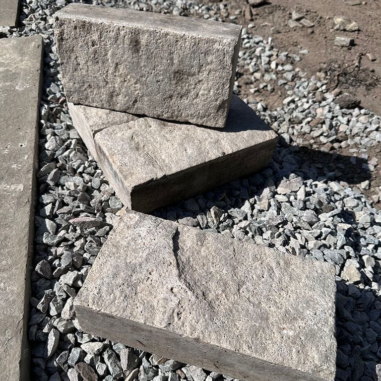 Application image for Reclaimed Rochester Limestone - Pavers. The surface finish shown is split-face. The dominant color shown is gray. The color mix creates a cool feeling.