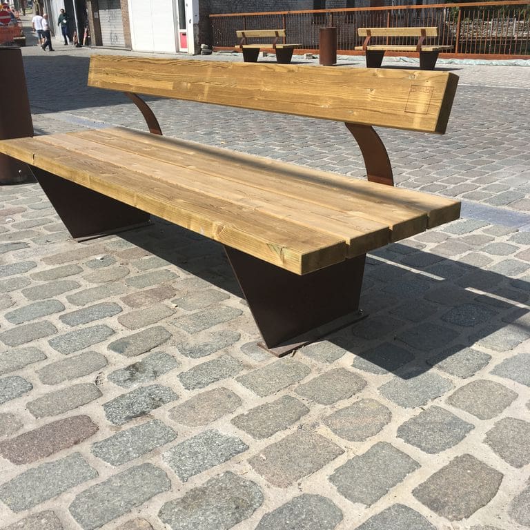 Feature image for Porphyry - Reclaimed European Cobblestones - Rectangle - Flat Surface. The image shows this product being used for path pavers, patio pavers and public area. The dominant color shown is gray. The color mix creates a warm feeling. Fine speckled color pattern.