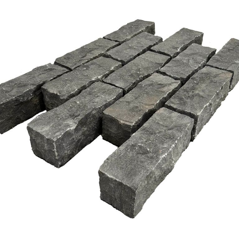 Feature image for Limestone - Highland Cobblestone - Rectangle - Split Top, Split Sides. The surface finish shown is split-face. The dominant color shown is black. The color mix creates a cool feeling.