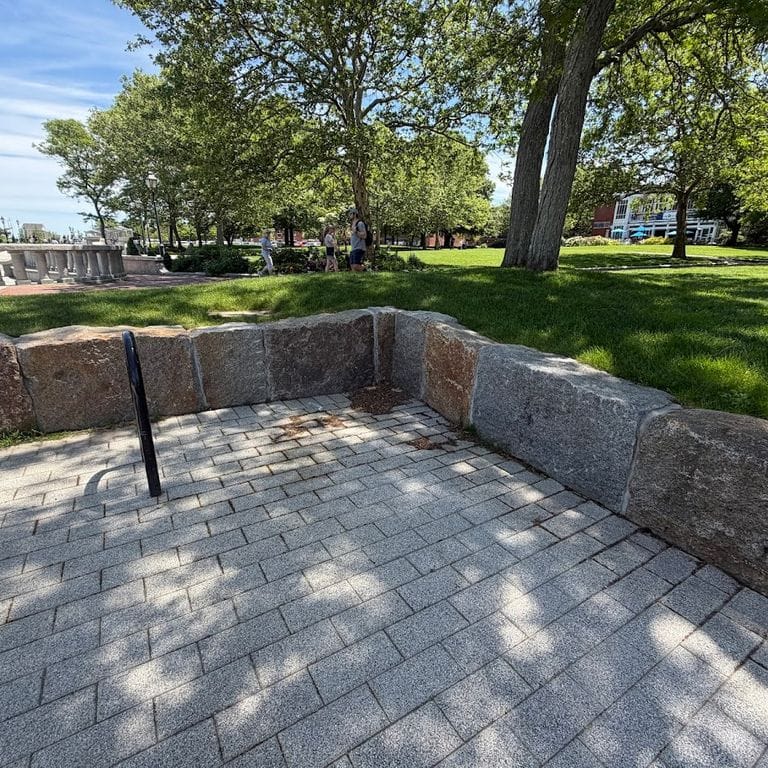 Application image for Reclaimed Granite Block - Seating Walls. The image shows this product being used in a seating &amp; benches application. The surface finish shown is . The dominant color shown is gray. The color mix creates a warm feeling.
