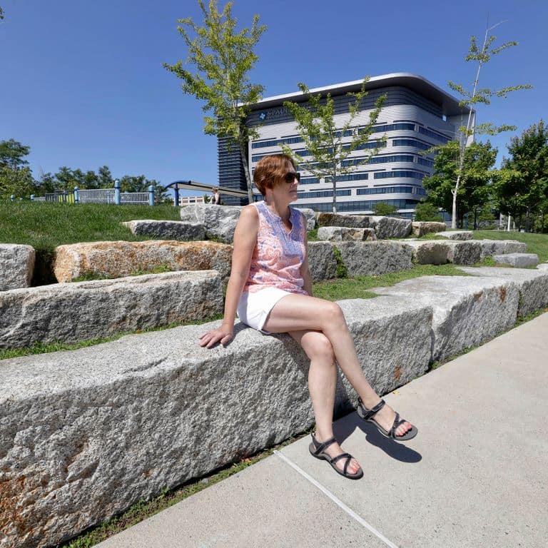 Application image for Reclaimed Granite Block - Seating Walls. The image shows this product being used for seating &amp; benches and landscape curbing &amp; edging. The surface finish shown is . The dominant color shown is gray. The color mix creates a warm feeling. Regular color pattern.