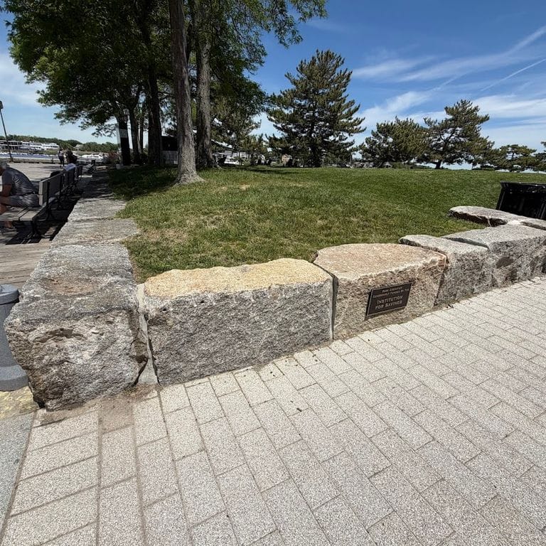 Application image for Reclaimed Granite Block - Seating Walls. The image shows this product being used in a seating &amp; benches application. The surface finish shown is . The dominant color shown is gray. The color mix creates a cool feeling.