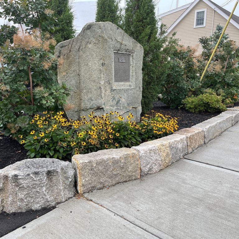 Application image for Reclaimed Granite Block - Seating Walls. The image shows this product being used for seating &amp; benches and landscape curbing &amp; edging. The surface finish shown is . The dominant color shown is gray; with a brown secondary.