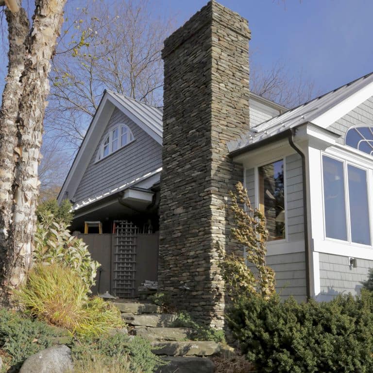 Application image for Fieldstone - Pennsylvania - Veneer. The image shows this product being used in a thin veneer application. The surface finish shown is split-face. Dominant colors shown are gray and tan. The color mix creates a warm feeling.