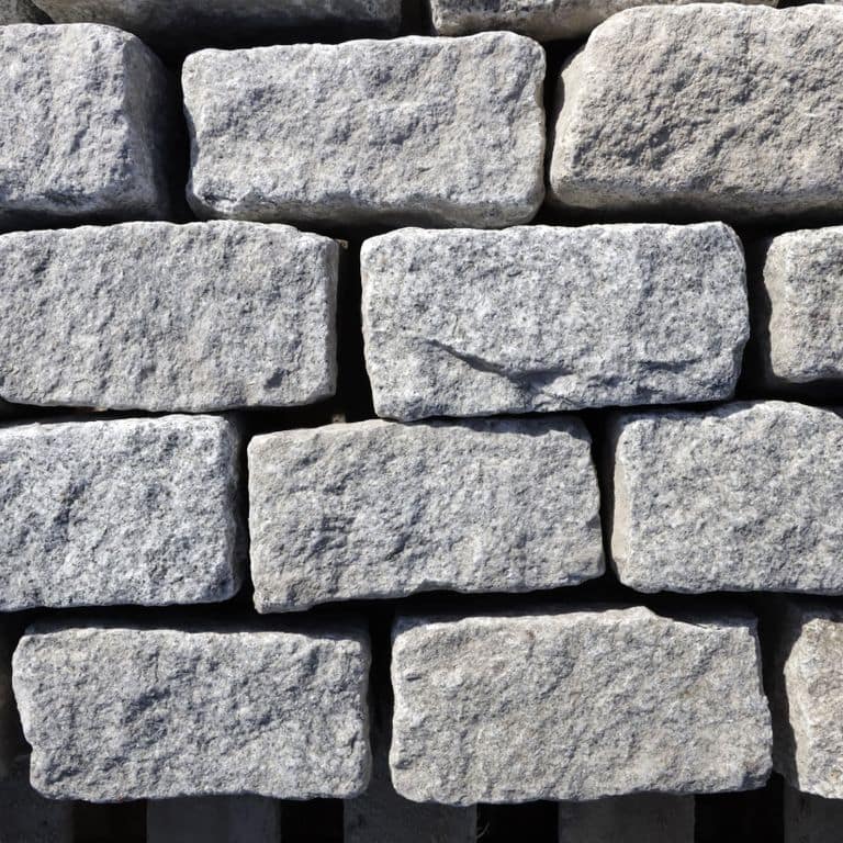 Best close-up image for Gray Granite Cobblestone - Squares. The dominant color shown is gray; with beige and white secondaries. The color mix creates a cool feeling. Speckled color pattern. Contains some mica.