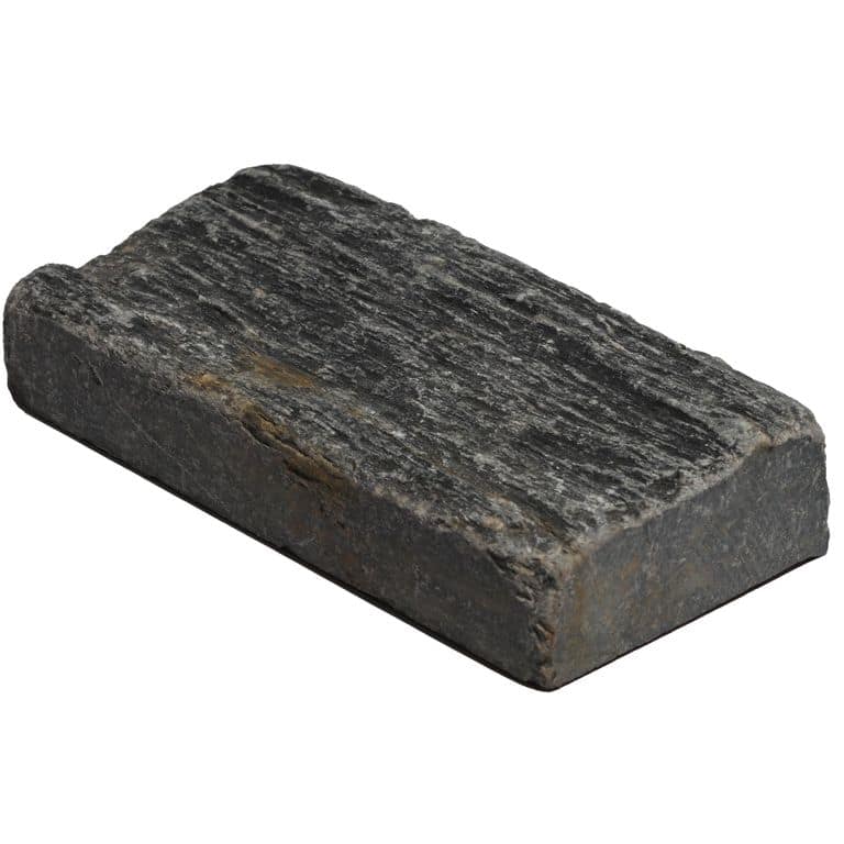 Oblique image for Black Shale Tumbled Cobblestones - Rectangles. The surface finish shown is tumbled. Dominant colors shown are black and gray. The color mix creates a cool feeling.