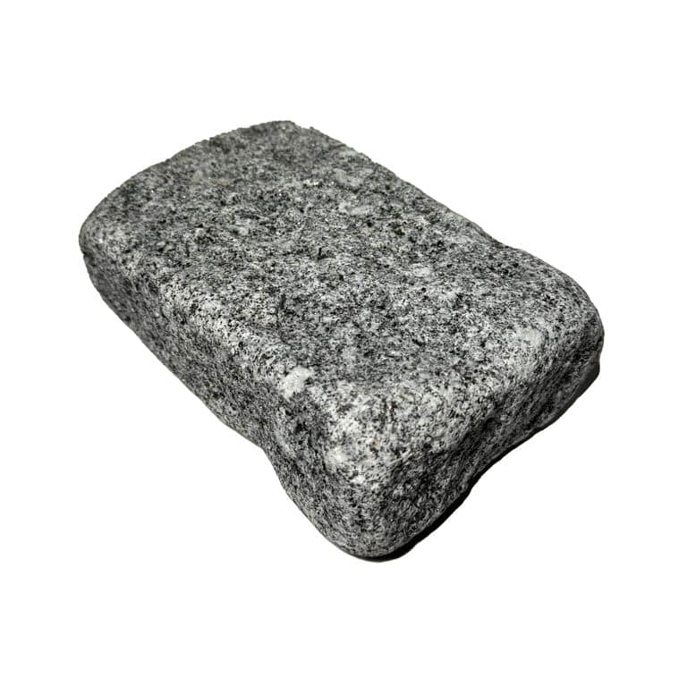 Oblique image for Republic Black Granite - Tumbled Cobblestones. The surface finish shown is tumbled. The dominant color shown is gray. The color mix creates a cool feeling.