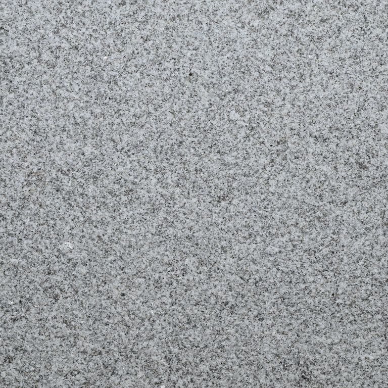 Color/Finish variation image for Gray Nisa Granite - Pavers. The surface finish shown is sand blasted. The dominant color shown is gray. The color mix creates a cool feeling.