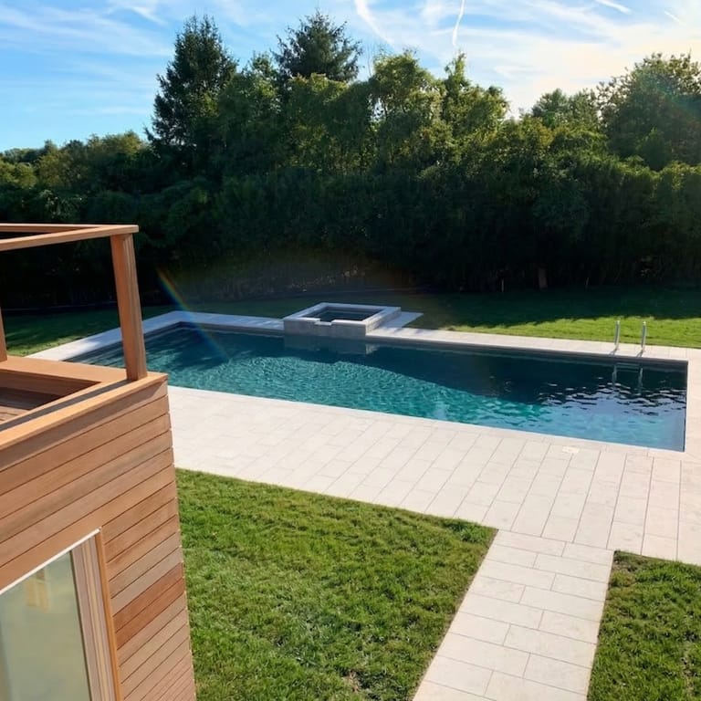 Application image for Moon Beige Limestone - Pavers. The image shows this product being used for pool coping, patio pavers and pool deck pavers. The surface finish shown is sand blasted. The dominant color shown is beige. The color mix creates a warm feeling.