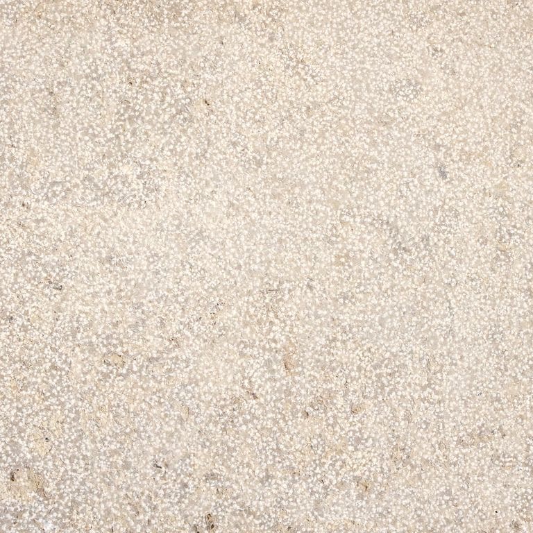 Color/Finish variation image for Bavarian Beige Limestone - Wall Cladding. The surface finish shown is bush hammered. Dominant colors shown are beige, gray and white; with a cream secondary. Speckled and cloudy color patterns.