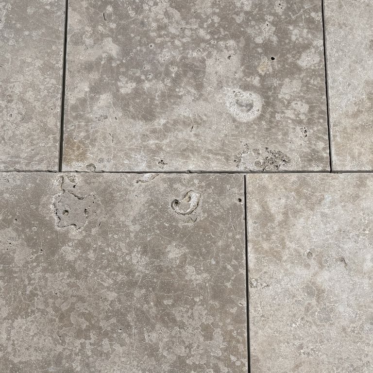 Best close-up image for Bavarian Dolomite Gray - Antiqued Interior Flooring. The surface finish shown is antiqued. The dominant color shown is gray. The color mix creates a warm feeling.