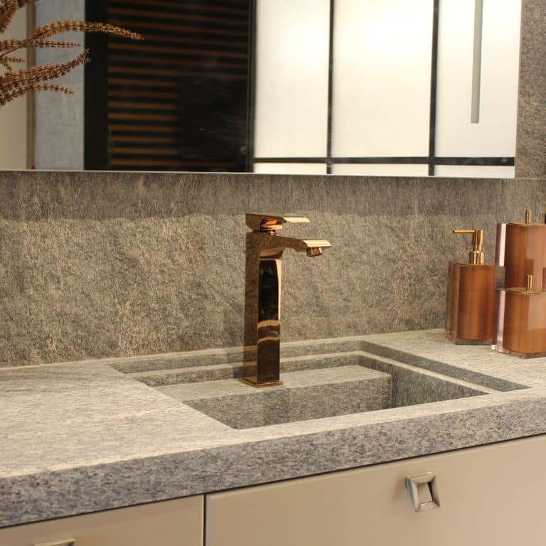 Best close-up image for Brazilian Lucerna Gneiss - Interior Wall Cladding. The image shows this product being used in an interior cladding application. The surface finish shown is split-face. The dominant color shown is gray. The color mix creates a warm feeling.