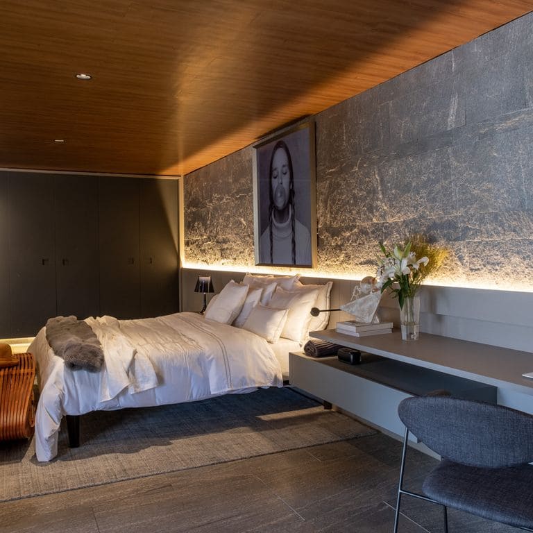 Application image for Brazilian Lucerna Gneiss - Interior Wall Cladding. The image shows this product being used in an interior cladding application. The surface finish shown is split-face. The dominant color shown is gray. The color mix creates a warm feeling.