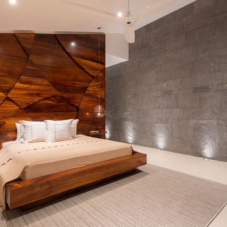 Application image for Brazilian Lucerna Gneiss - Interior Wall Cladding. The image shows this product being used in an interior cladding application. The surface finish shown is split-face. The dominant color shown is gray. The color mix creates a warm feeling.