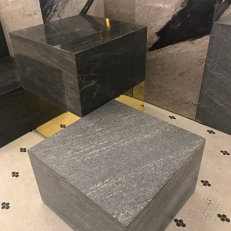 Application image for Brazilian Lucerna Gneiss - Benches. The image shows this product being used in a seating &amp; benches application. The surface finish shown is flamed. The dominant color shown is gray. The color mix creates a warm feeling.