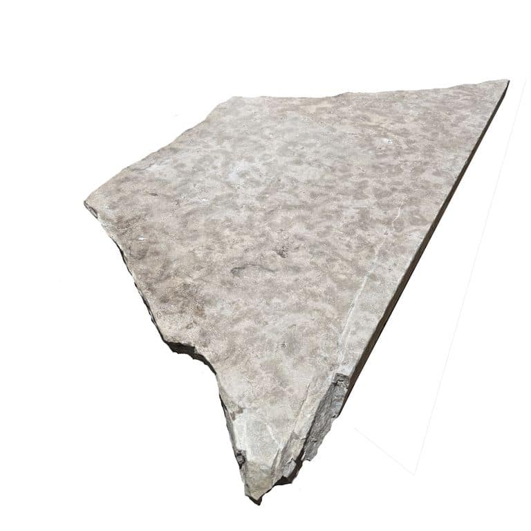 Oblique image for Lannon Gray Limestone - Natural Surface Irregular Pavers. The surface finish shown is flamed. The dominant color shown is gray. The color mix creates a cool feeling.